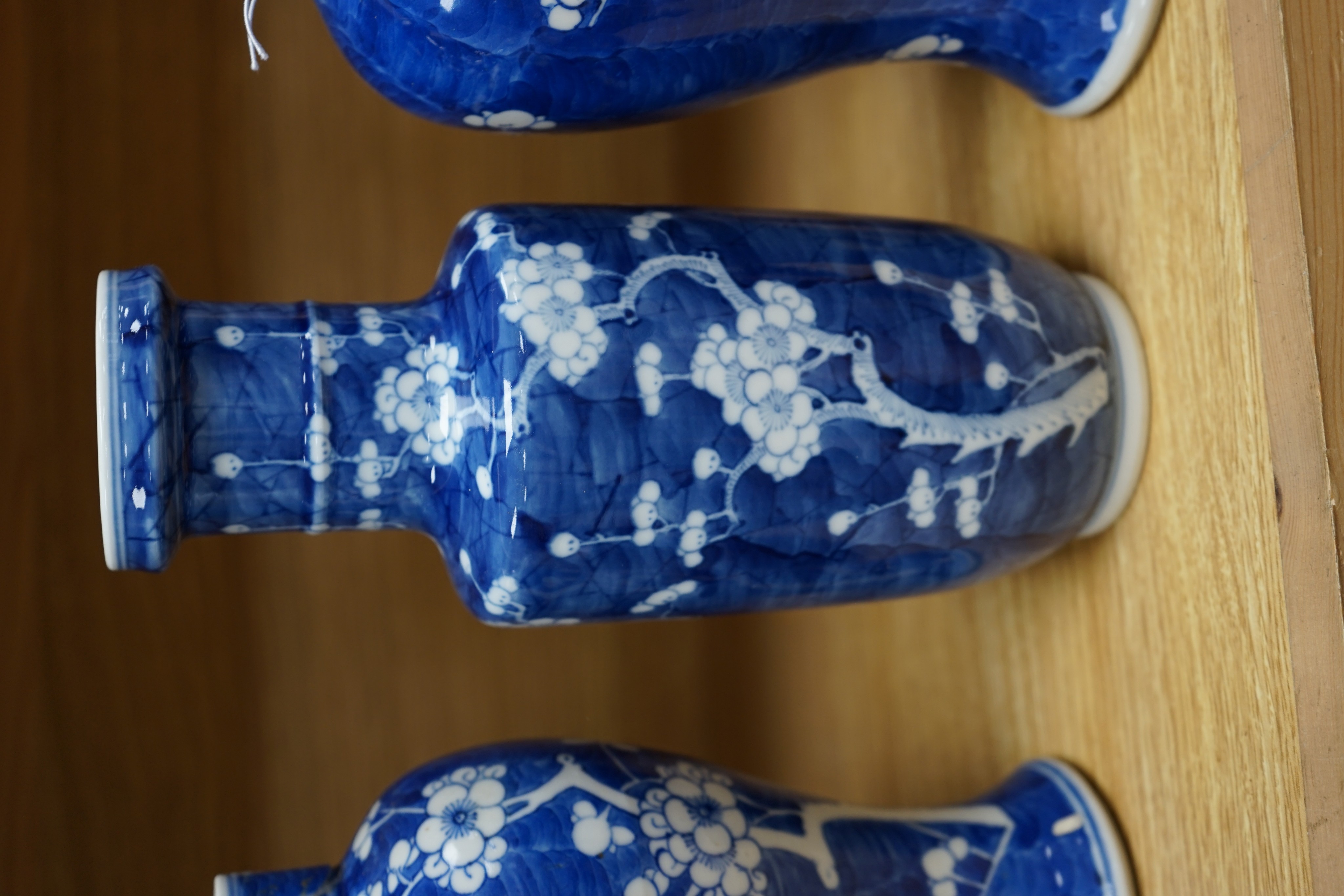 Three Chinese blue and white prunus vases. 25.5cm